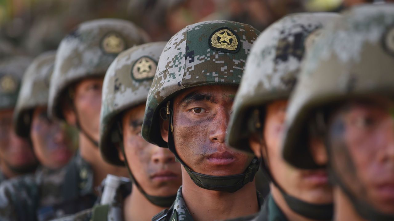 Soldier’s from China’s People’s Liberation Army stand in line